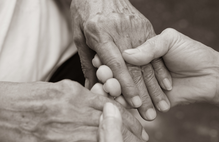 elder abuse caregiver hands photo
